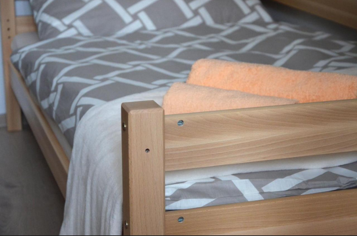 Close view of a single bed in the Kamzík 2 room