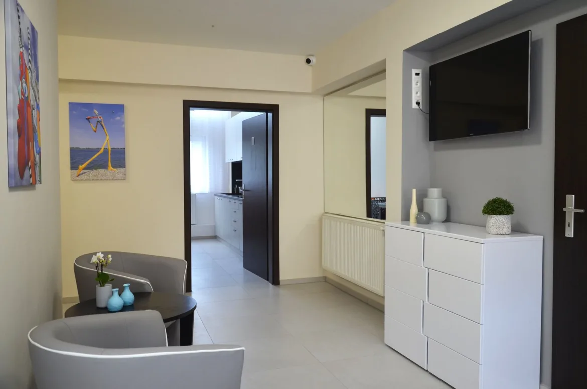 Shared lounge with TV and seating