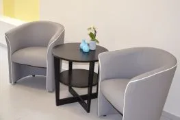 Armchairs and table in the shared lounge