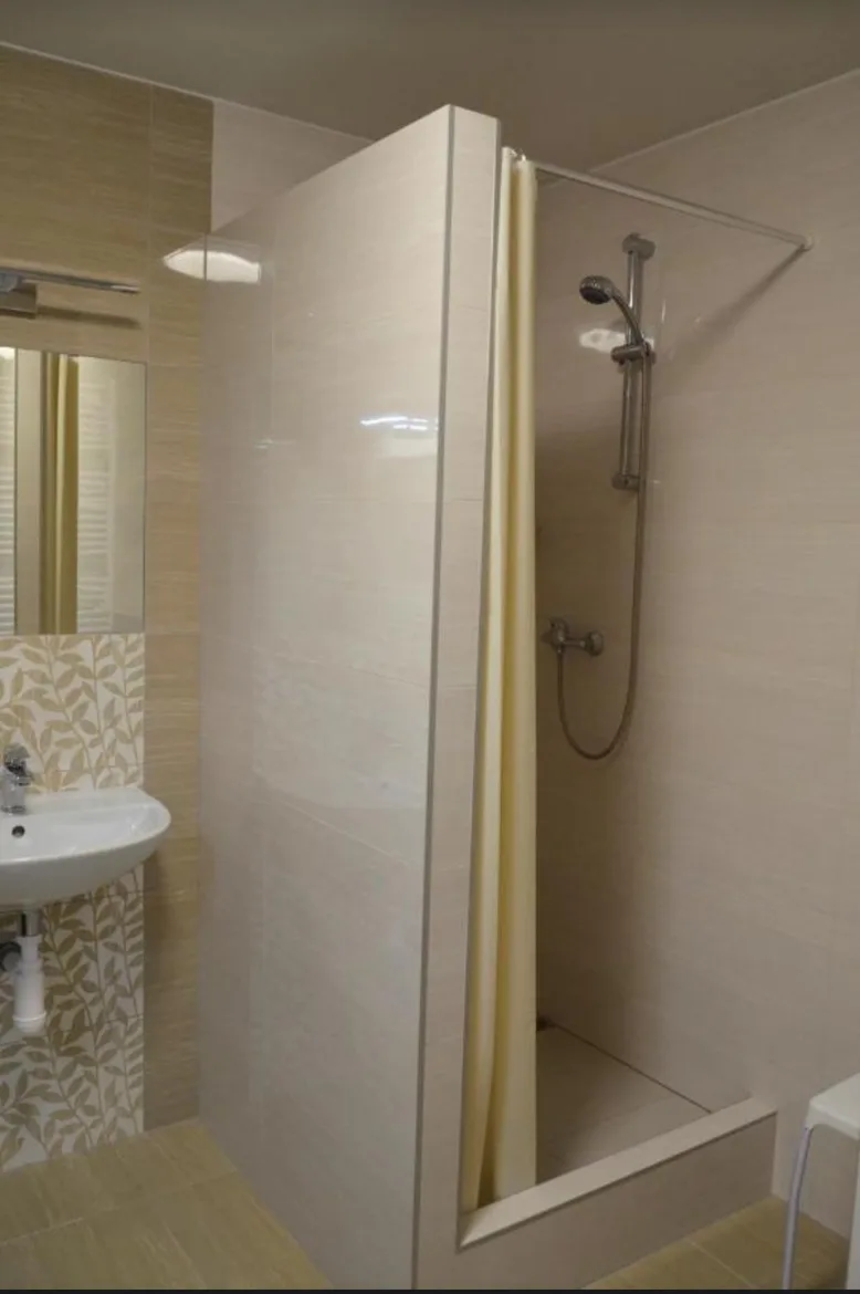 Shower cubicle in a shared bathroom