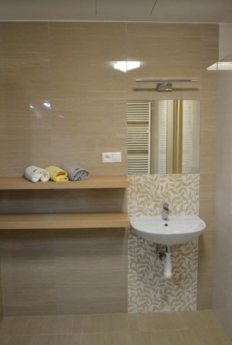 Sink and mirror in a shared bathroom
